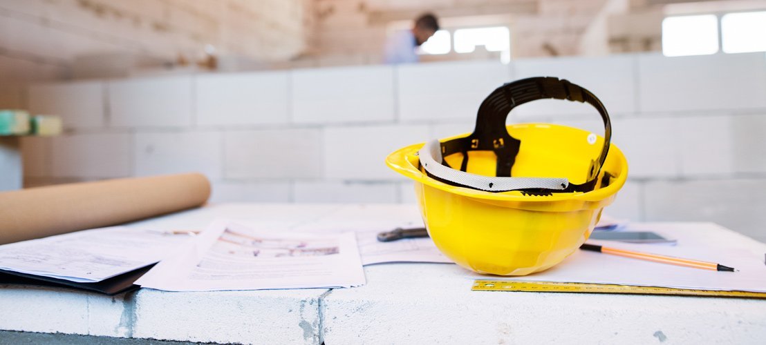 A yellow hard hat on the table