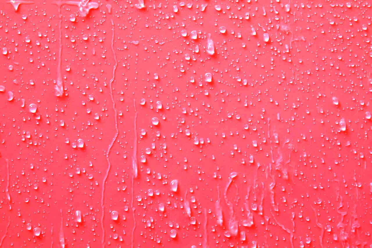 waterdrops on a red surface