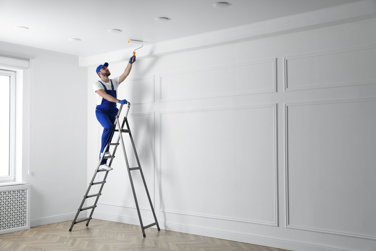 worker doing ceiling paint